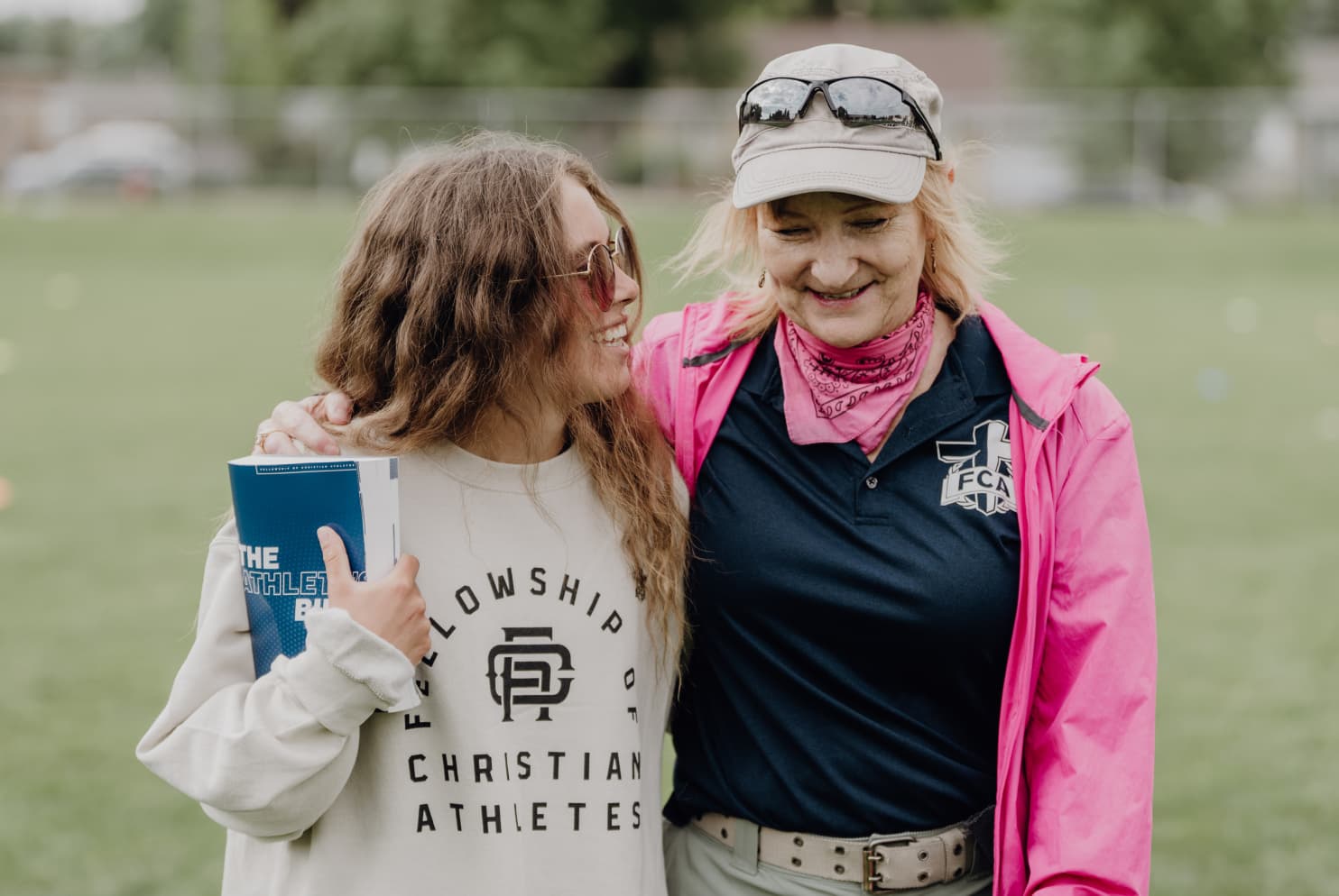 Athlete and coach smiling together